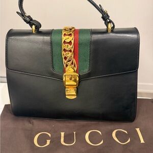 Gucci Black Leather Handbag with Gold Accents